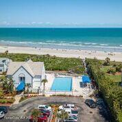 817 Mystic Drive, Unit B410 Cape Canaveral, FL 32920 - Photo 2 of 28 a view of an ocean and beach