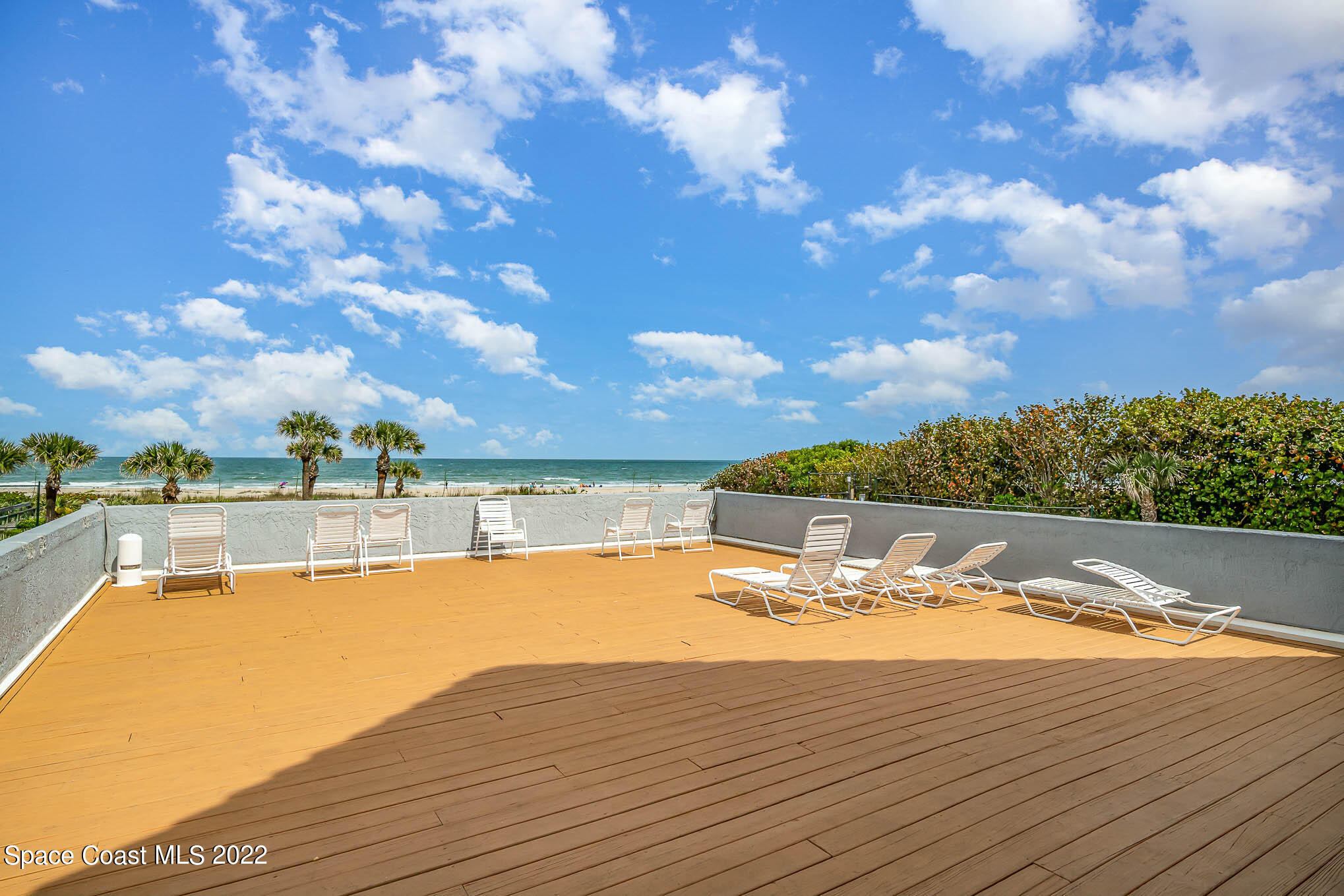 817 Mystic Drive, Unit B410 Cape Canaveral, FL 32920 - Photo 22 of 28 a view of a swimming pool with an ocean view