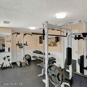 817 Mystic Drive, Unit B410 Cape Canaveral, FL 32920 - Photo 25 of 28 a view of a room with gym equipment
