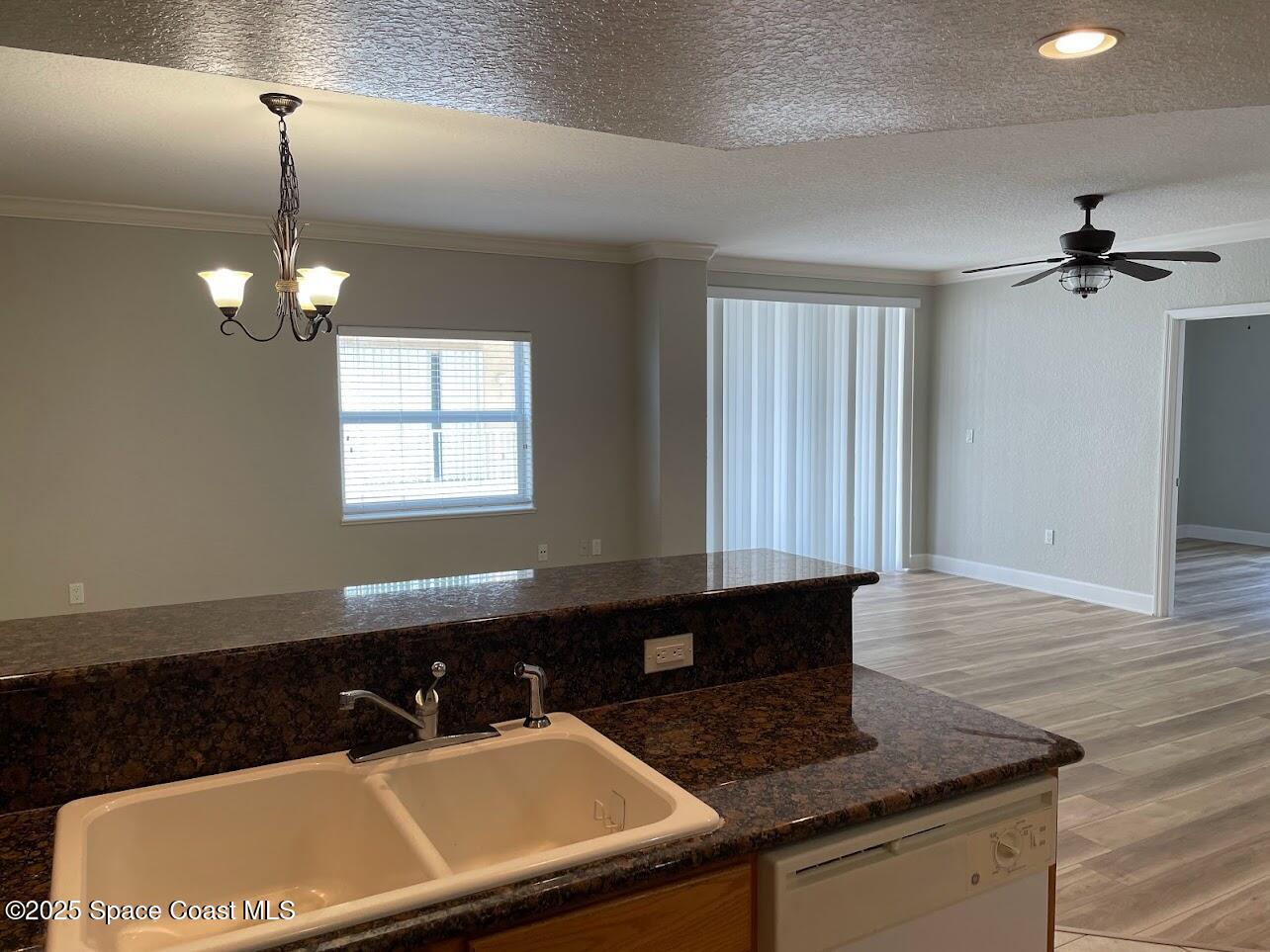 817 Mystic Drive, Unit B410 Cape Canaveral, FL 32920 - Photo 5 of 28 a bathroom with a sink a vanity and a mirror