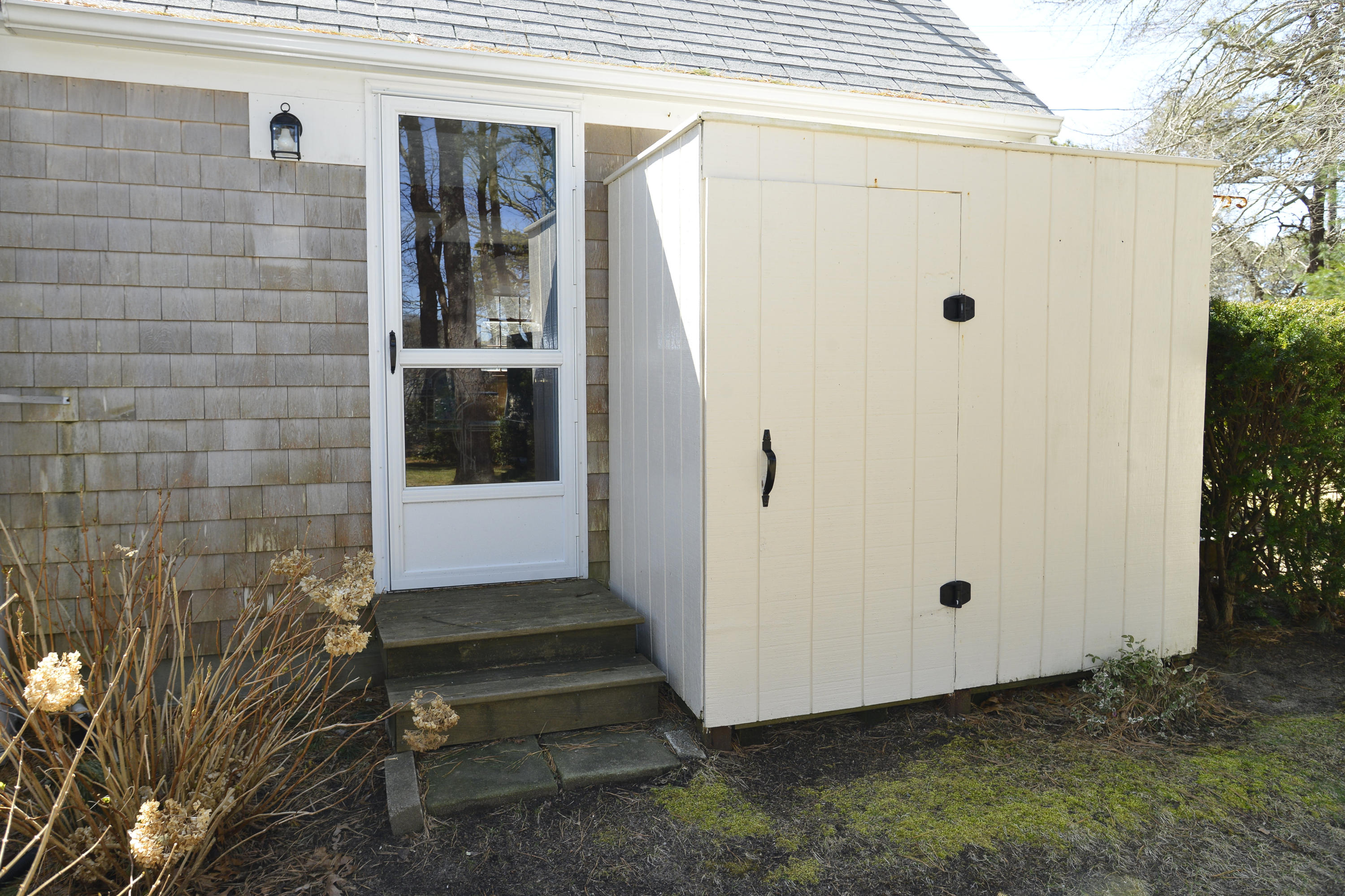 26 Lower County Road Dennis Port, MA 02639 - Photo 27 of 32 a view of a door and a window