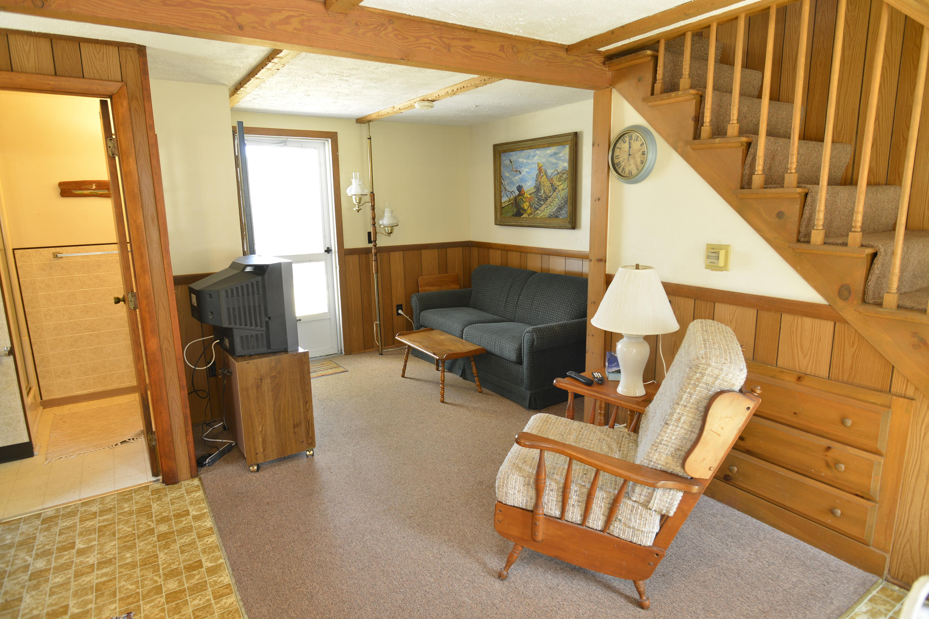 26 Lower County Road Dennis Port, MA 02639 - Photo 29 of 32 a living room with furniture and a wooden floor