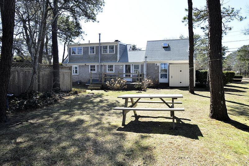 26 Lower County Road Dennis Port, MA 02639 - Photo 5 of 32 a view of a swimming pool with a patio