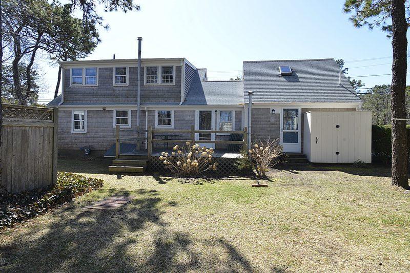 26 Lower County Road Dennis Port, MA 02639 - Photo 6 of 32 a view of a house with yard and sitting area