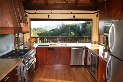 195 Crest Road Novato, CA 94945 - Photo 4 of 12 a kitchen with stainless steel appliances granite countertop a refrigerator a stove and a wooden floor