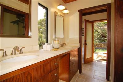 195 Crest Road Novato, CA 94945 - Photo 8 of 12 a bathroom with a double vanity sink and a mirror