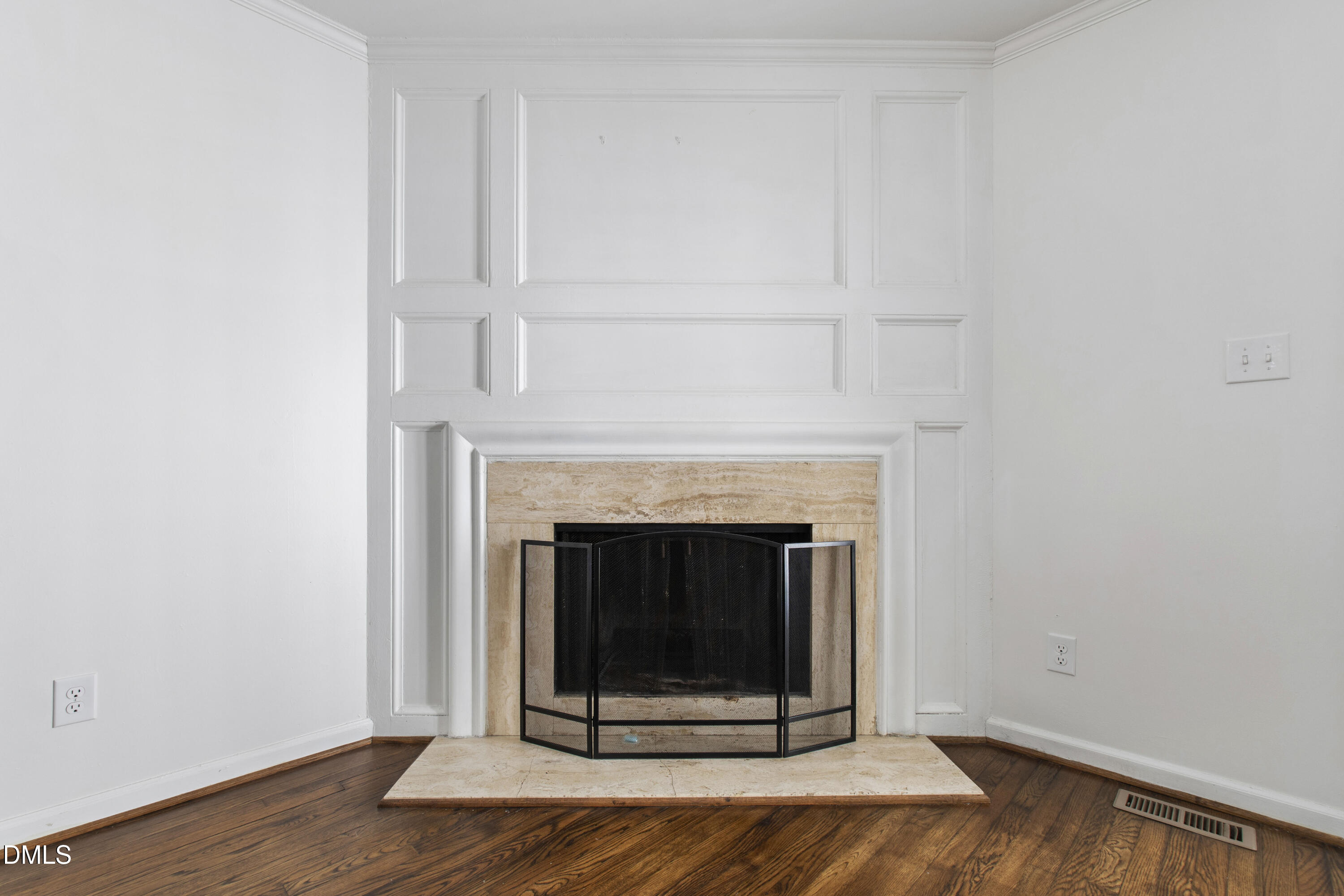 2824 Wayland Drive Raleigh, NC 27608 - Photo 15 of 31 a view of a livingroom with wooden floor and a fireplace