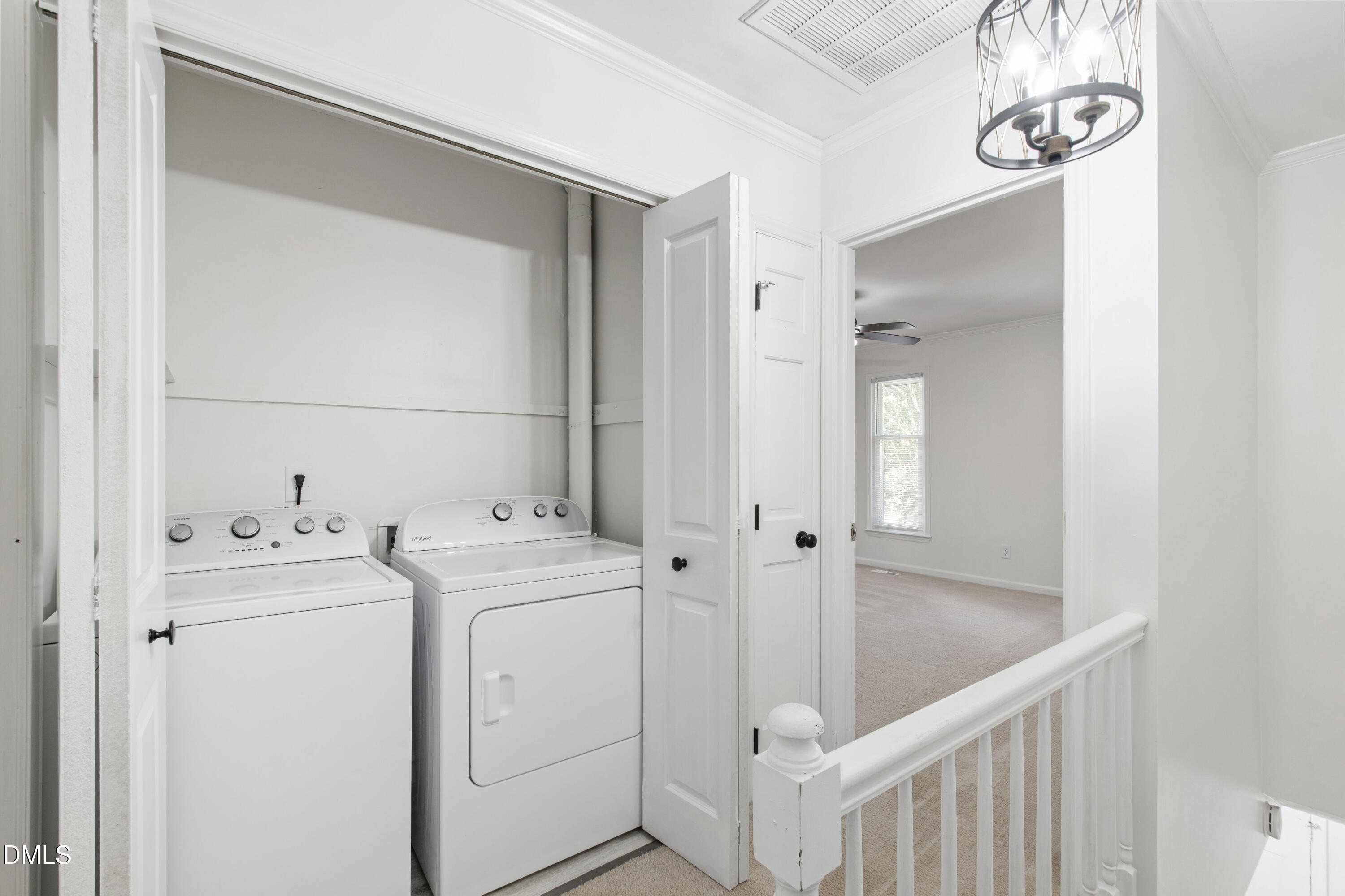2824 Wayland Drive Raleigh, NC 27608 - Photo 19 of 31 a view of washer and dryer with bathroom in the background