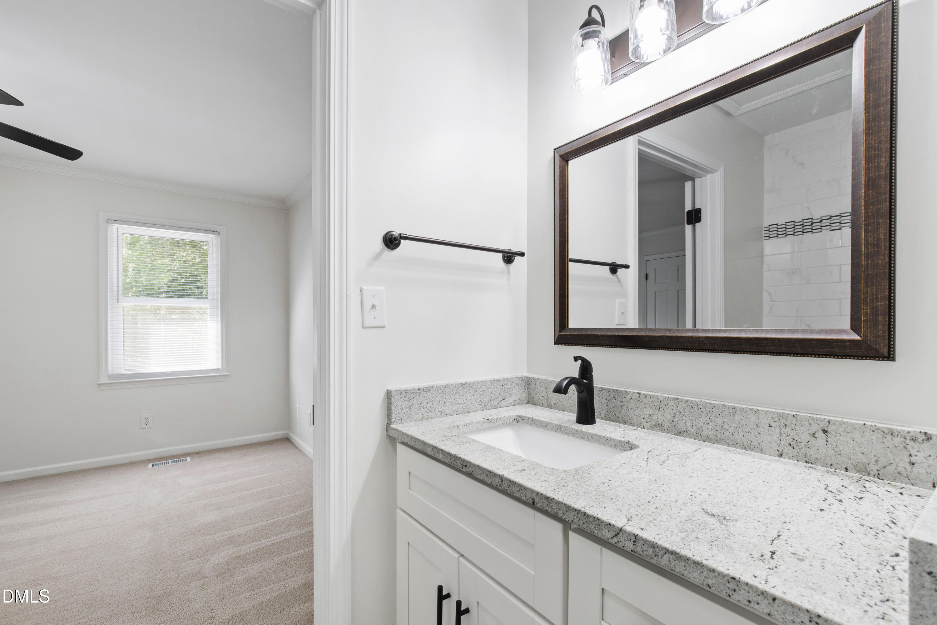 2824 Wayland Drive Raleigh, NC 27608 - Photo 23 of 31 a bathroom with a sink and a mirror