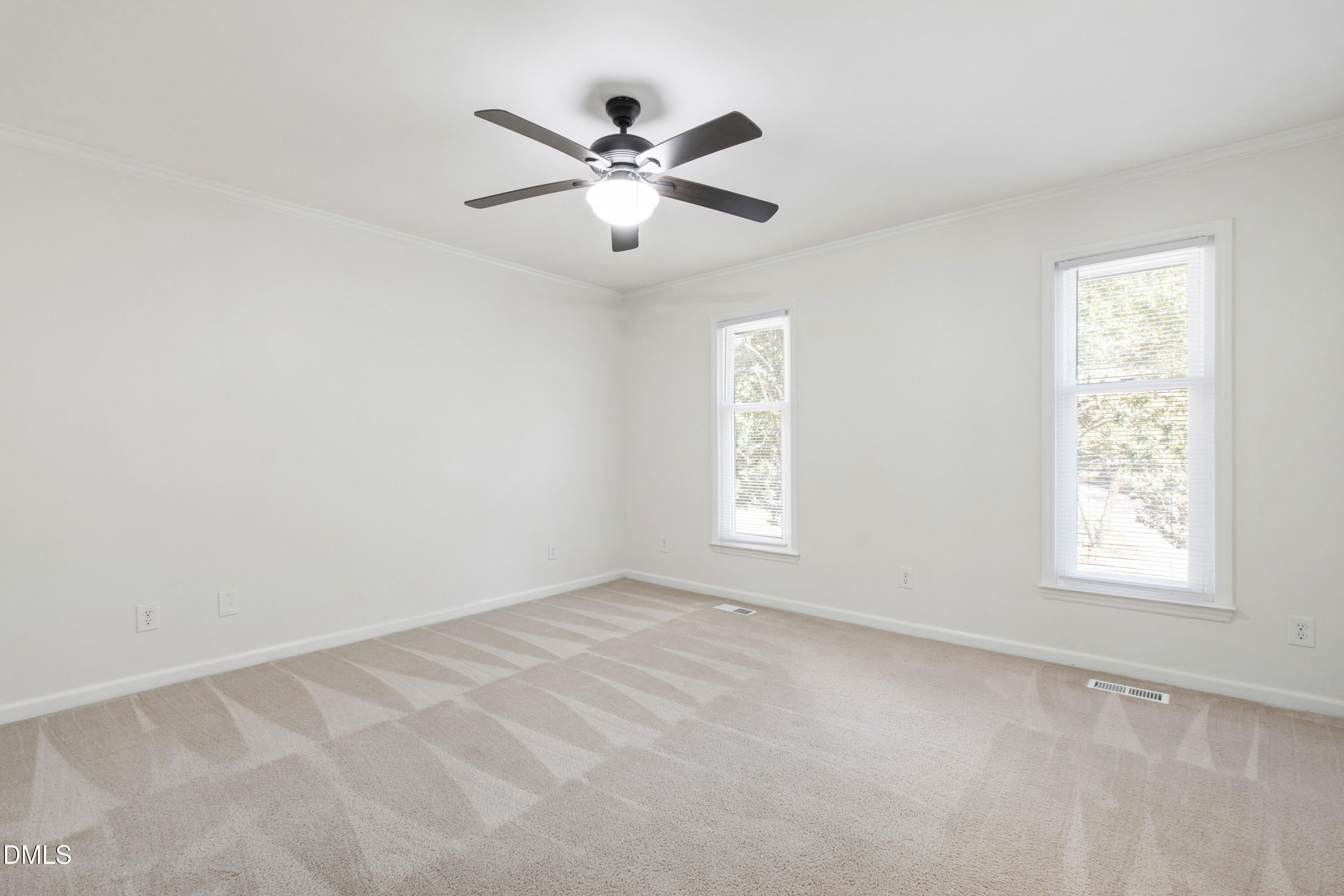2824 Wayland Drive Raleigh, NC 27608 - Photo 25 of 31 an empty room with windows and fan