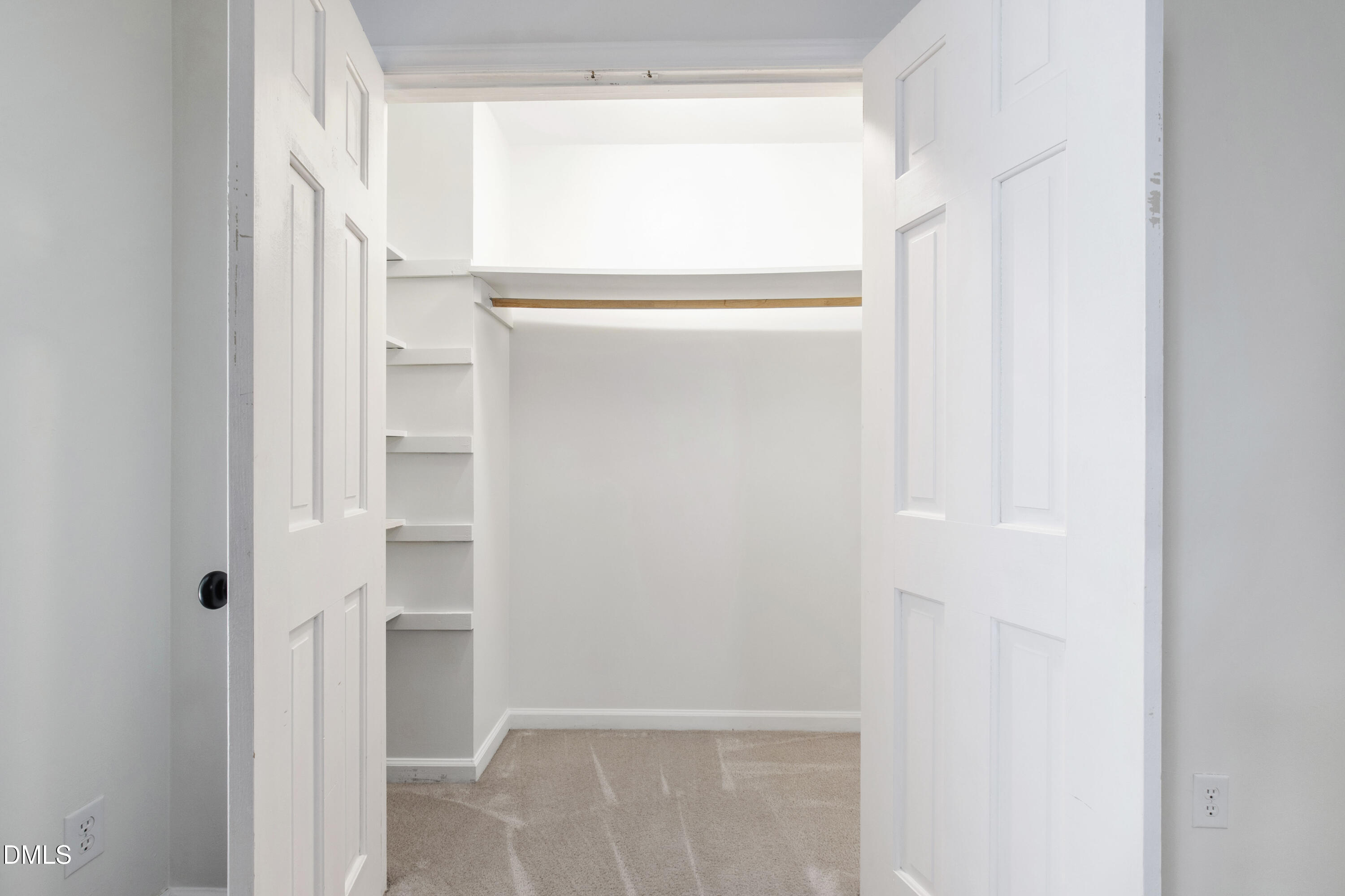 2824 Wayland Drive Raleigh, NC 27608 - Photo 27 of 31 a view of walk in closet with empty racks