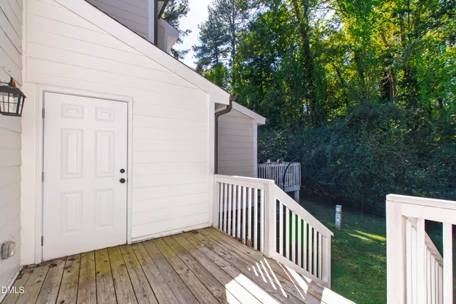 a view of front door and small yard