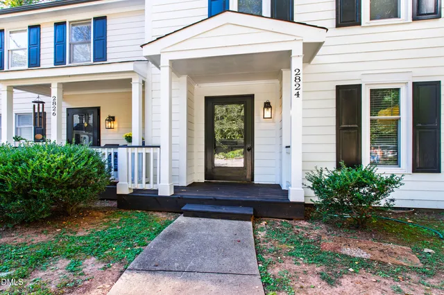 front view of a house with a yard