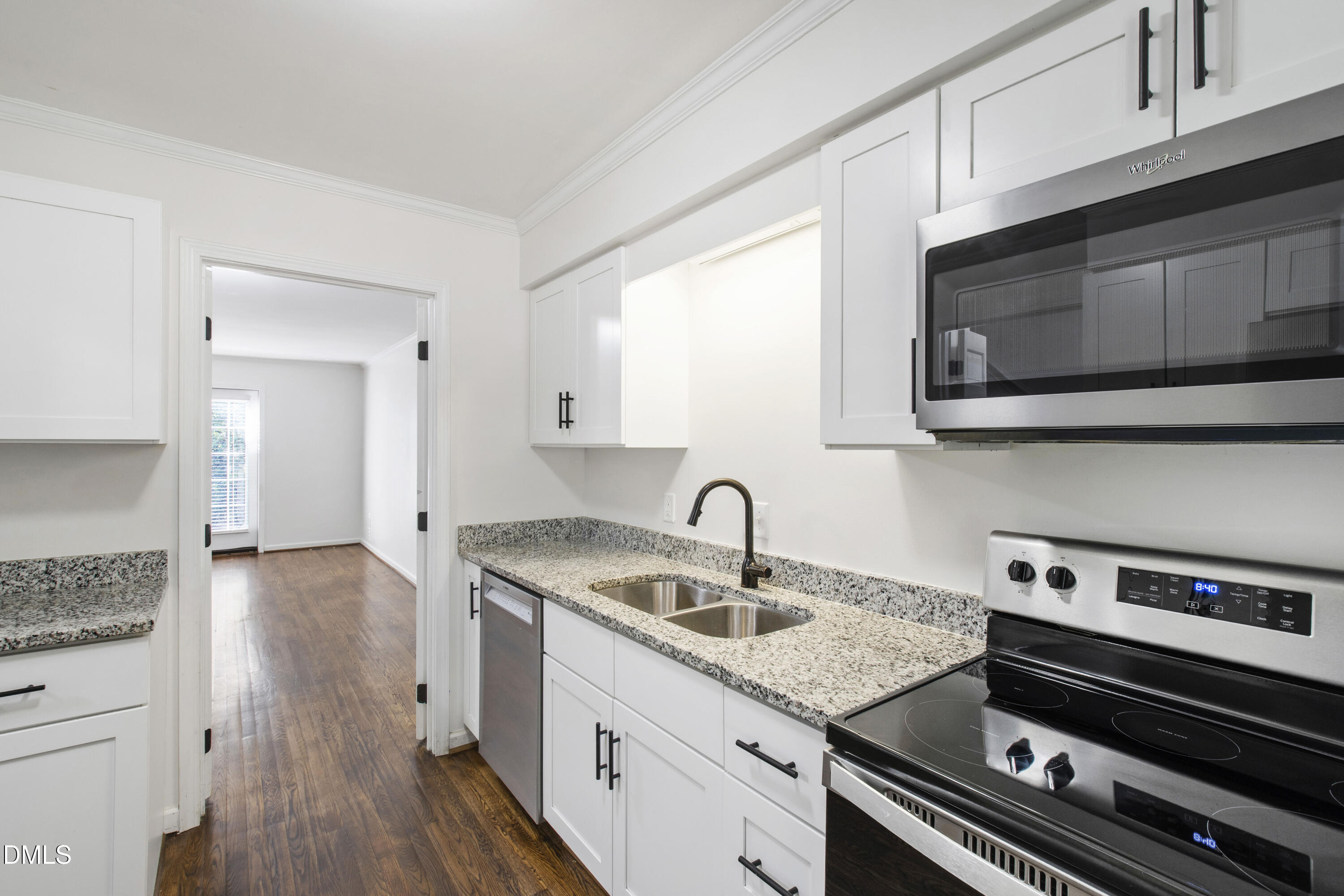2824 Wayland Drive Raleigh, NC 27608 - Photo 10 of 31 a kitchen with a sink stove and cabinets