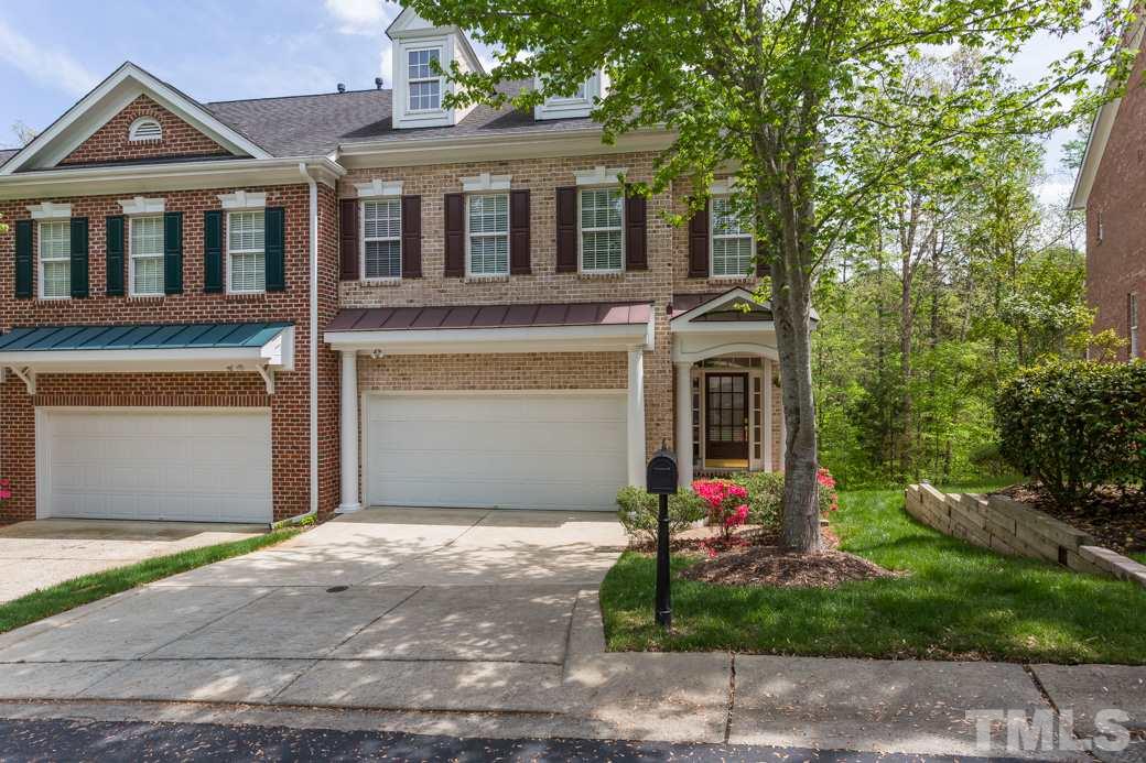 7260 Summit Waters Lane Raleigh, NC 27613 - Photo 1 of 23 a front view of a house with yard