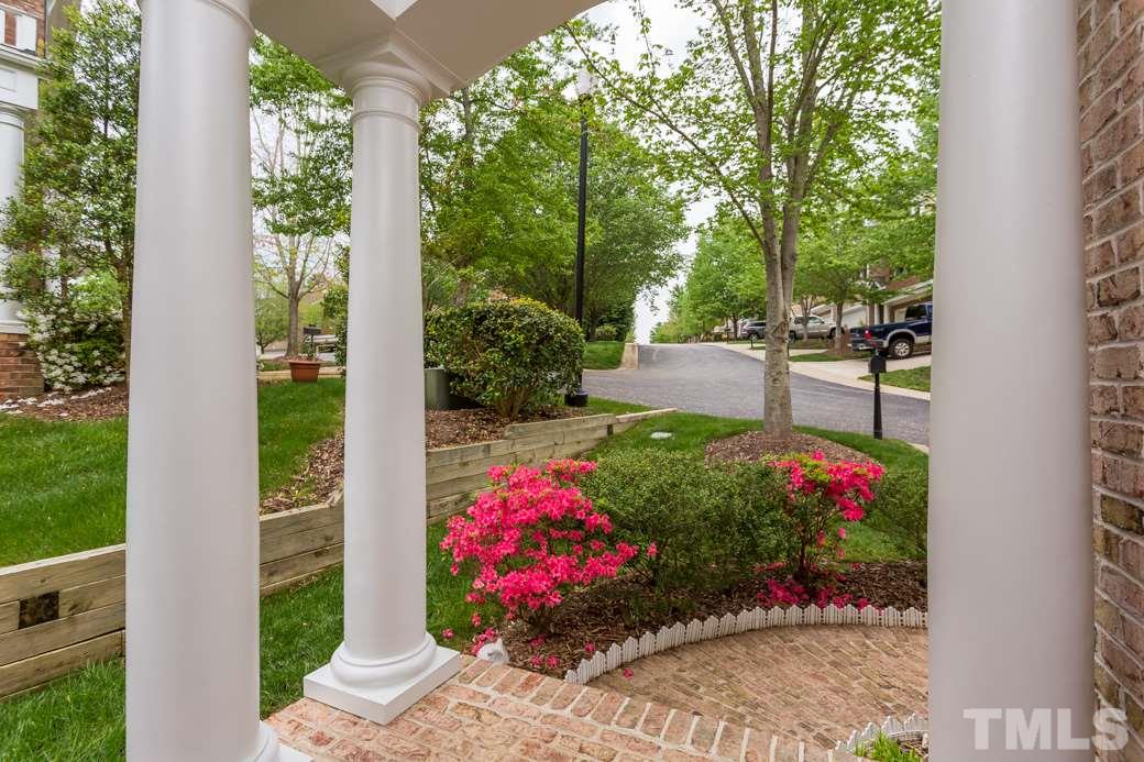 7260 Summit Waters Lane Raleigh, NC 27613 - Photo 2 of 23 a view of a potted flower in a yard with potted plants