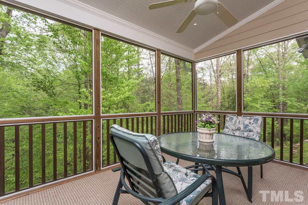 7260 Summit Waters Lane Raleigh, NC 27613 - Photo 12 of 23 a view of a balcony with a table and chairs