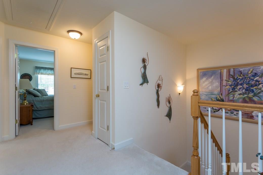 7260 Summit Waters Lane Raleigh, NC 27613 - Photo 13 of 23 a view of a livingroom with wooden floor and a ceiling fan