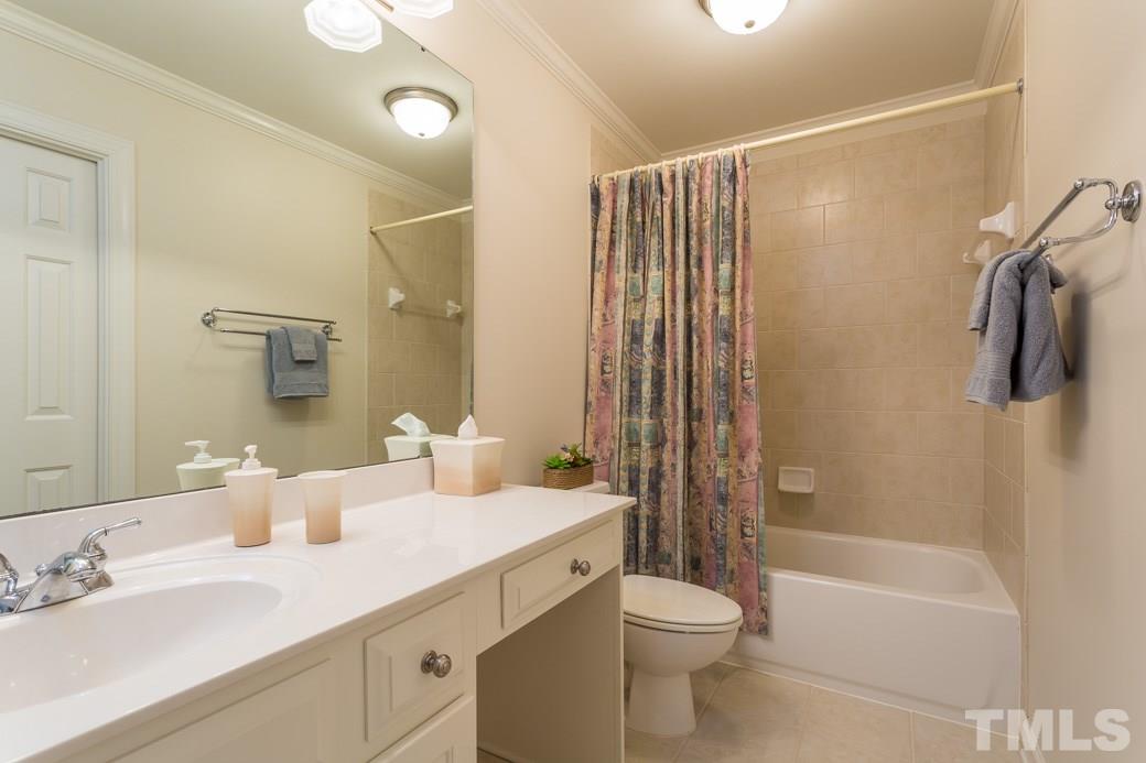 7260 Summit Waters Lane Raleigh, NC 27613 - Photo 18 of 23 a bathroom with a double vanity sink toilet and shower