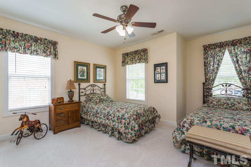 7260 Summit Waters Lane Raleigh, NC 27613 - Photo 19 of 23 a living room with furniture and a large window