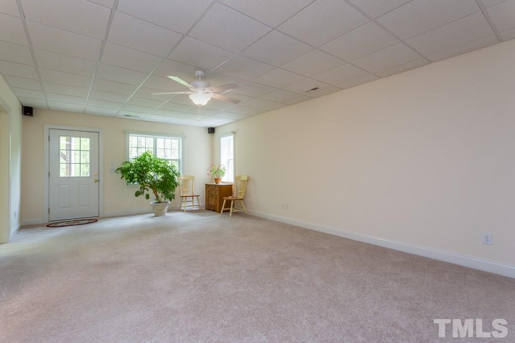 7260 Summit Waters Lane Raleigh, NC 27613 - Photo 20 of 23 an empty room with windows and flower in it
