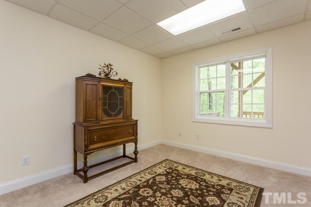 7260 Summit Waters Lane Raleigh, NC 27613 - Photo 21 of 23 a living room with a dresser and a window