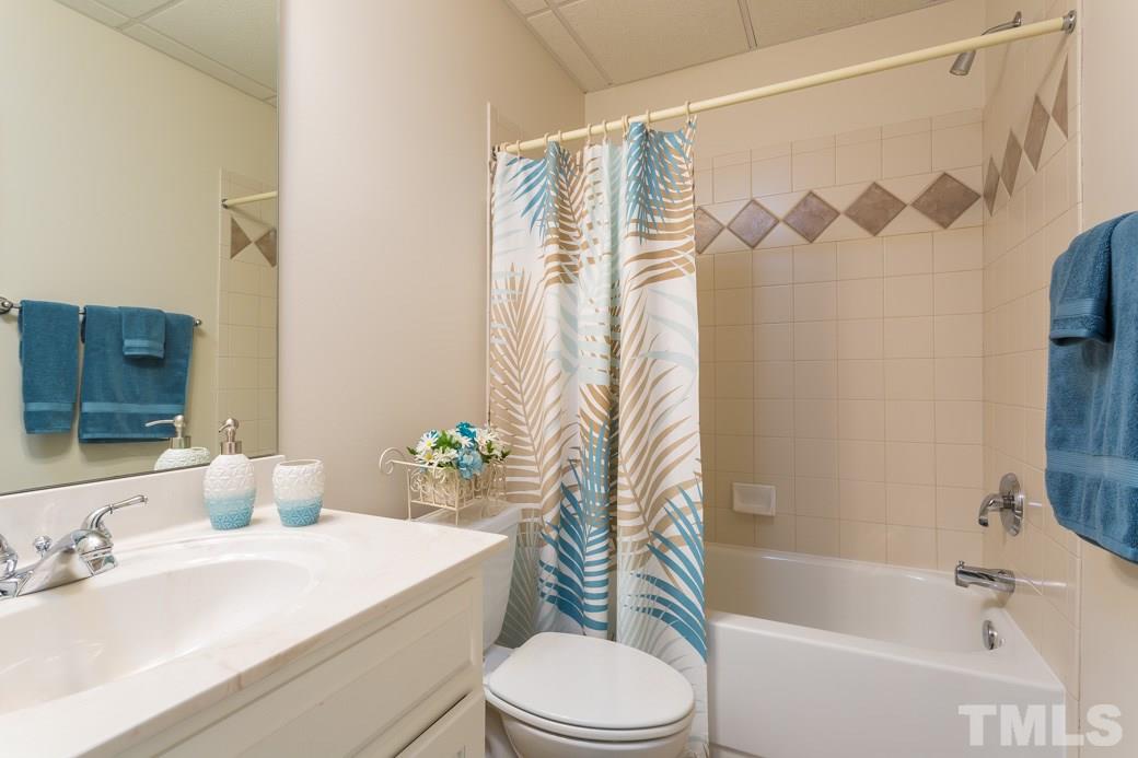 7260 Summit Waters Lane Raleigh, NC 27613 - Photo 22 of 23 a bathroom with a sink toilet and shower