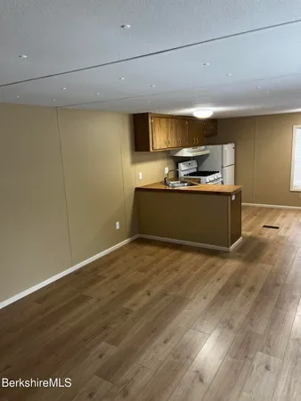 a view of kitchen with wooden floor