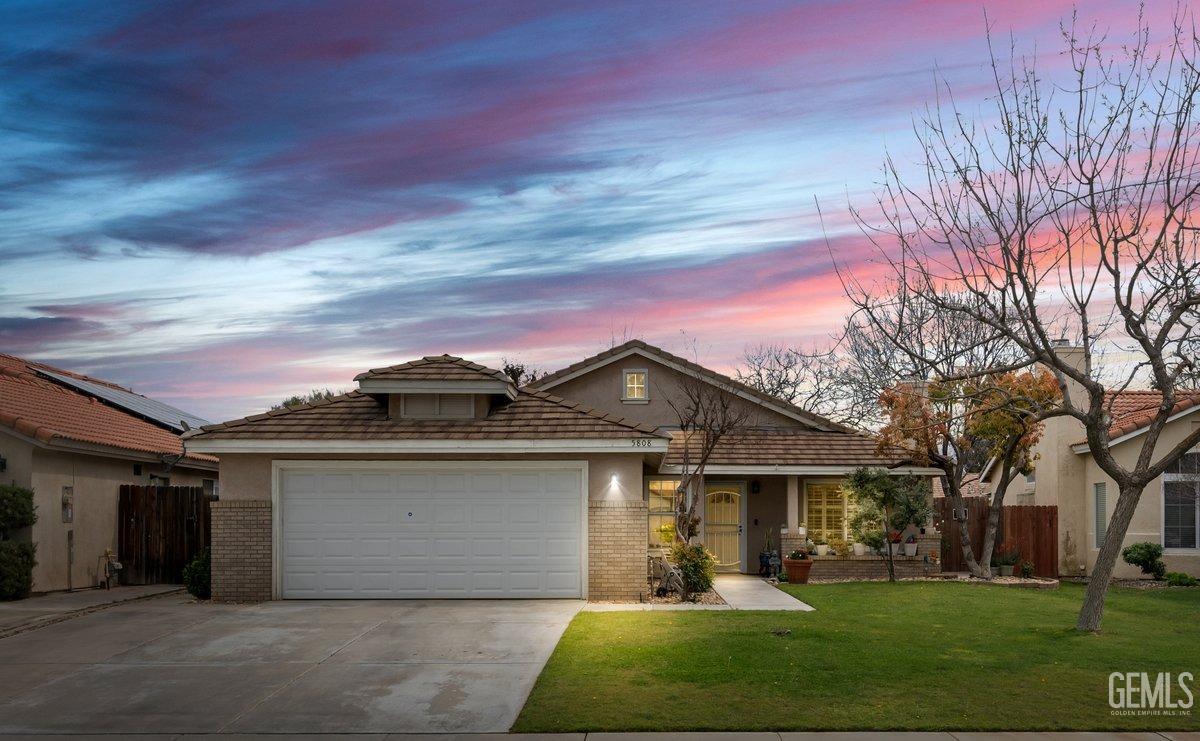 Undisclosed Address Bakersfield, CA 93312 - Photo 2 of 31 front view of a house with a yard