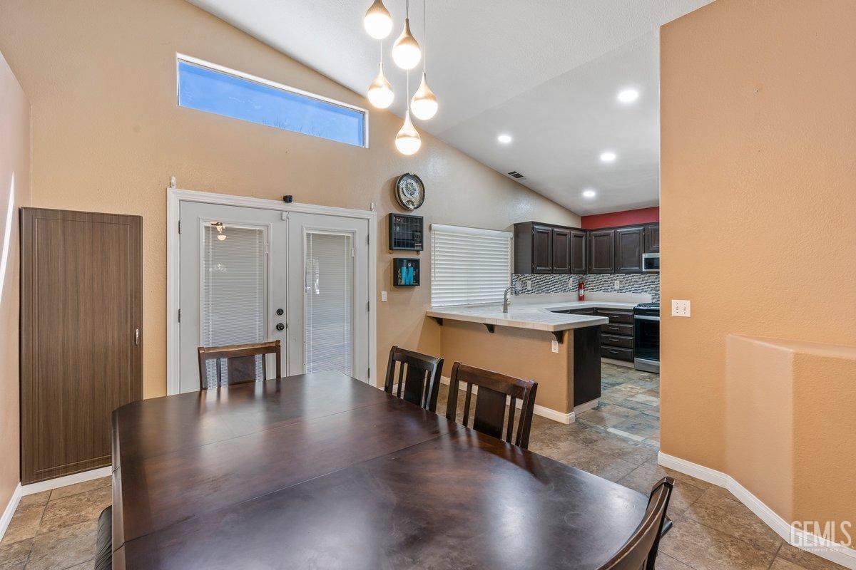 Undisclosed Address Bakersfield, CA 93312 - Photo 24 of 31 a kitchen with a table and chairs