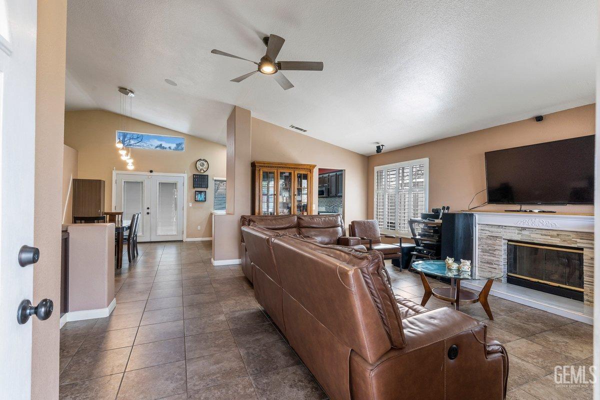 Undisclosed Address Bakersfield, CA 93312 - Photo 27 of 31 a living room with fireplace furniture and a flat screen tv