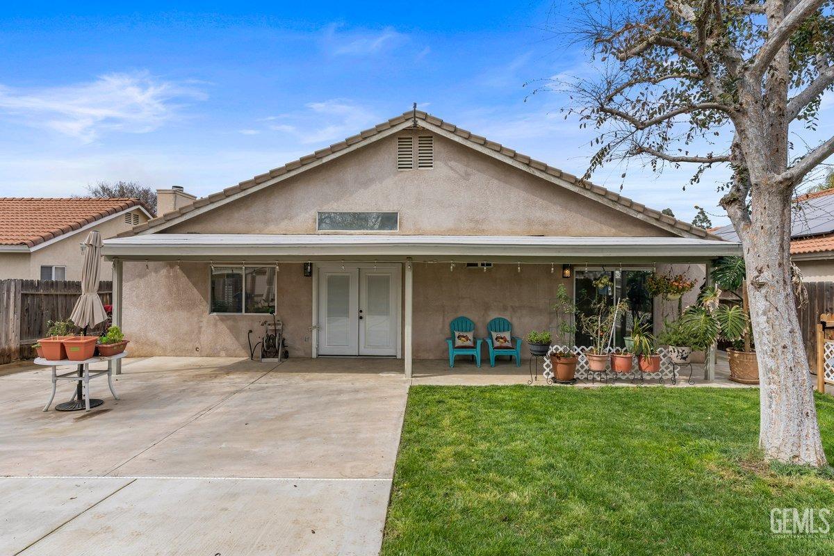 Undisclosed Address Bakersfield, CA 93312 - Photo 28 of 31 a view of a chair and tables in the back yard of the house