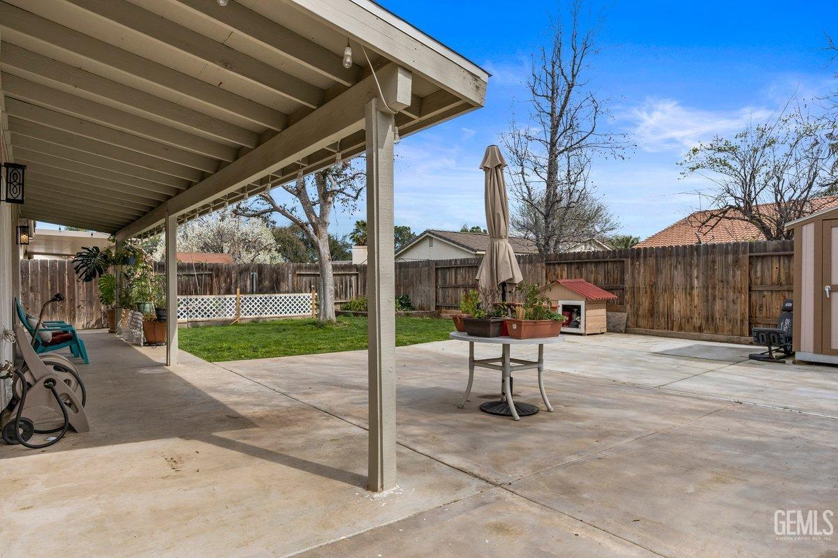 Undisclosed Address Bakersfield, CA 93312 - Photo 31 of 31 a view of a backyard with table and chairs and a small yard