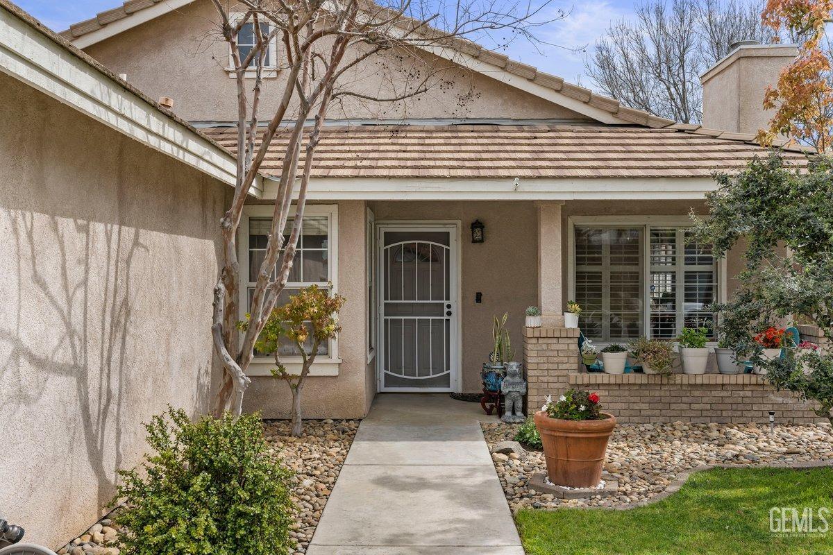 Undisclosed Address Bakersfield, CA 93312 - Photo 6 of 31 a front view of a house with garden
