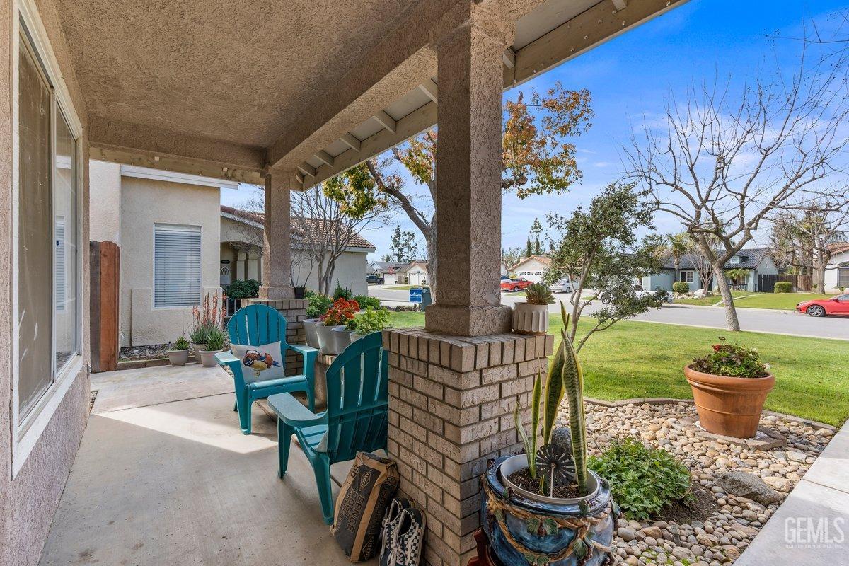 Undisclosed Address Bakersfield, CA 93312 - Photo 7 of 31 a view of a patio with a chairs and table in a patio