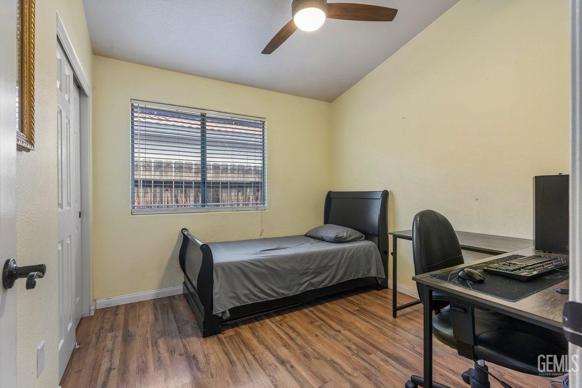 Undisclosed Address Bakersfield, CA 93312 - Photo 9 of 31 a bedroom with bed and a window