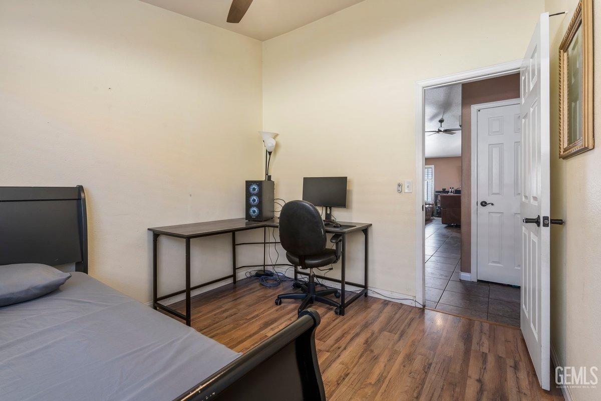 Undisclosed Address Bakersfield, CA 93312 - Photo 10 of 31 a view of a workspace with furniture and wooden floor