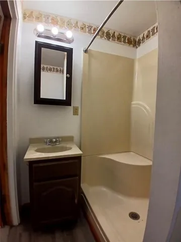 a bathroom with a sink and mirror