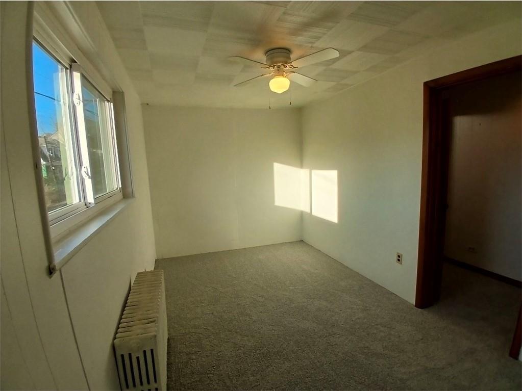 231 Rinne Street Pittsburgh, PA 15210 - Photo 14 of 24 a view of an empty room with a window