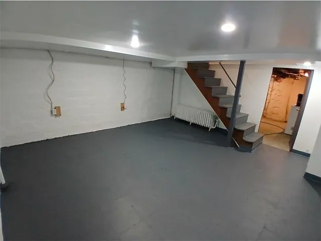 a view of a storage & utility room with stairs