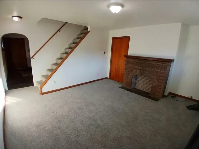 an empty room with staircase