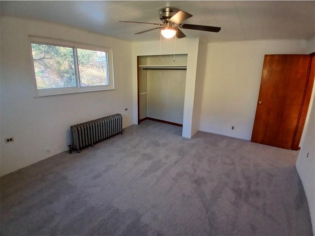 231 Rinne Street Pittsburgh, PA 15210 - Photo 10 of 24 an empty room with windows and fan