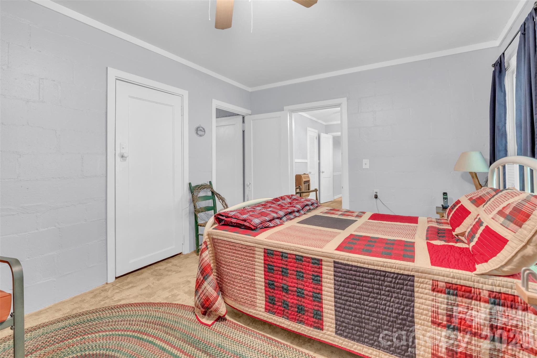3605 Skyuka Mountain Road Columbus, NC 28722 - Photo 17 of 48 a bedroom with bed and a mirror