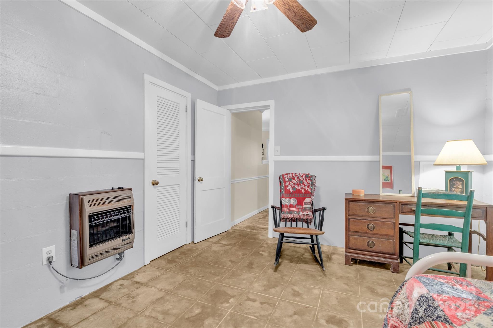 3605 Skyuka Mountain Road Columbus, NC 28722 - Photo 18 of 46 a living room with furniture a flat screen tv and a chandelier