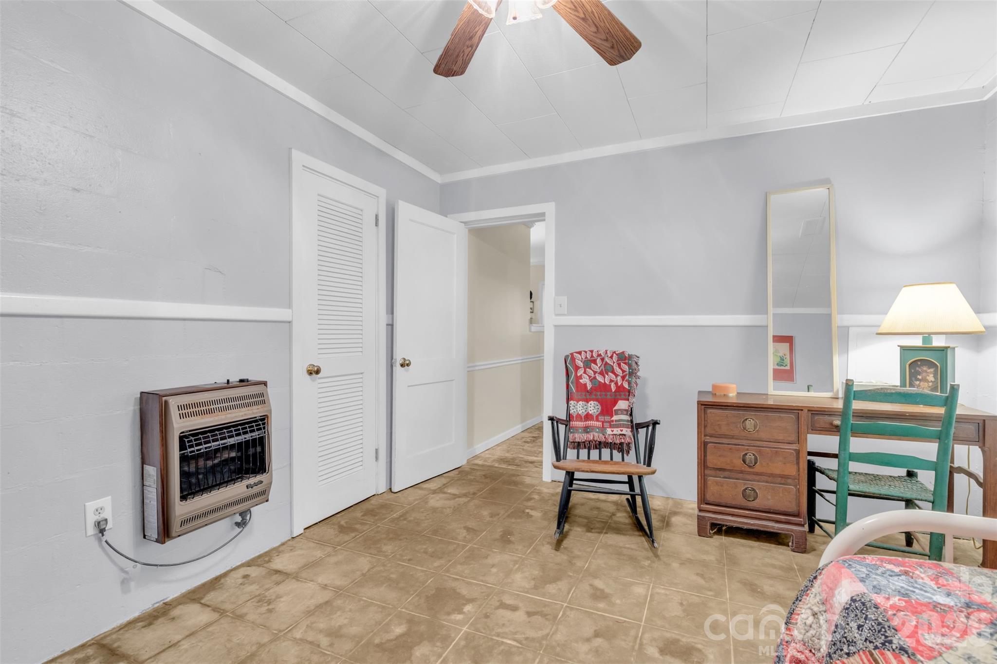 3605 Skyuka Mountain Road Columbus, NC 28722 - Photo 20 of 48 a living room with furniture a flat screen tv and a chandelier