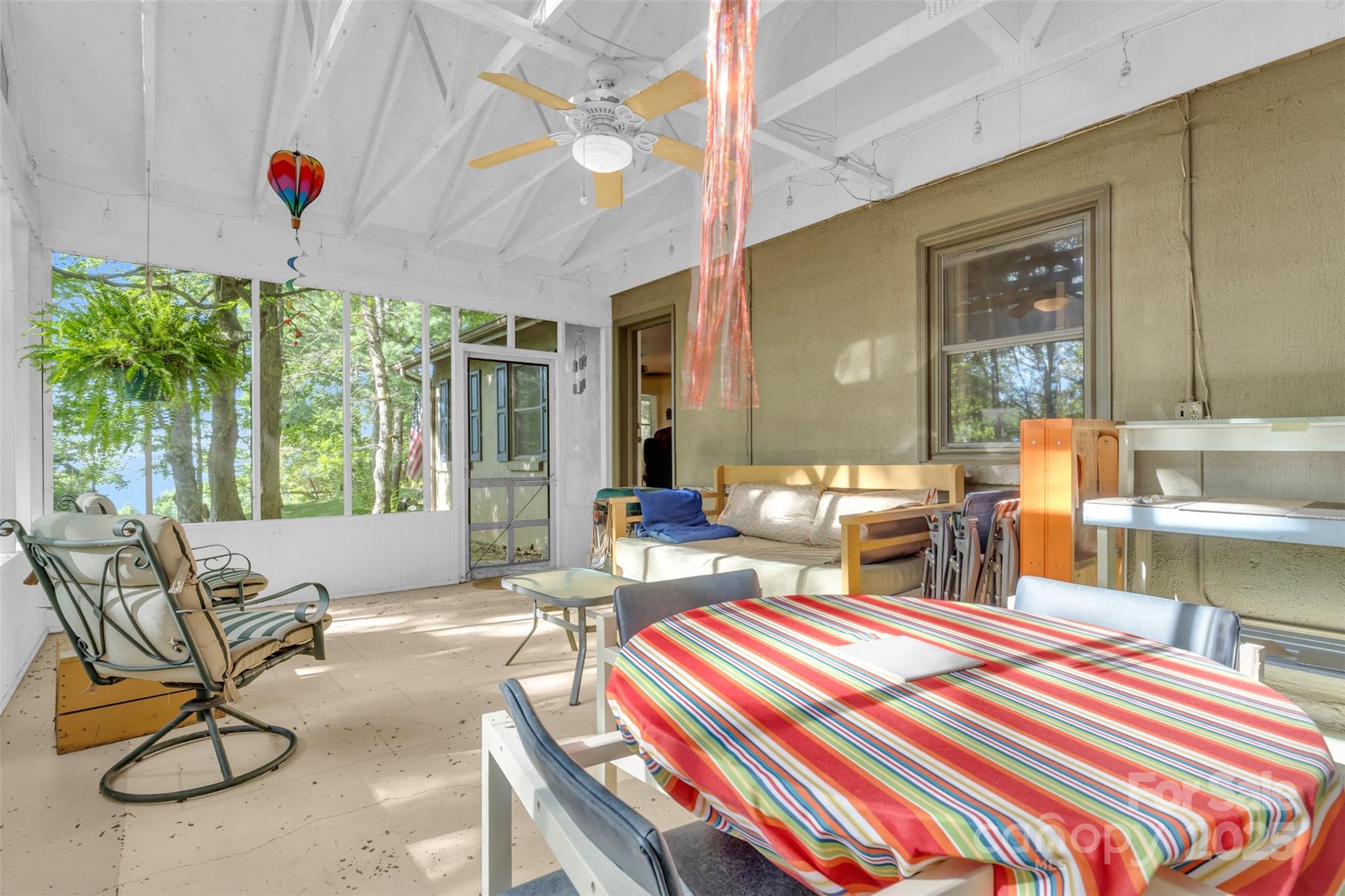 3605 Skyuka Mountain Road Columbus, NC 28722 - Photo 21 of 46 a bedroom with furniture and a large window