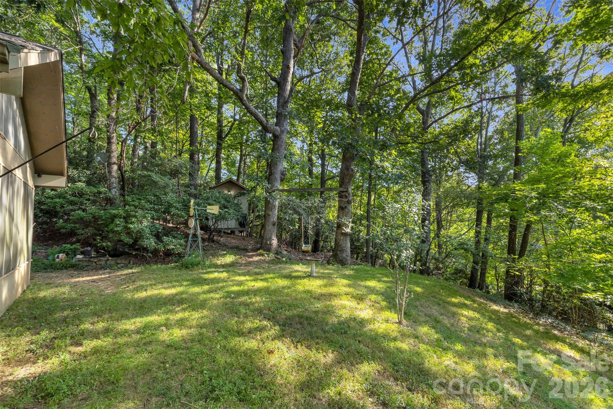 3605 Skyuka Mountain Road Columbus, NC 28722 - Photo 26 of 48 a view of outdoor space with trees all around