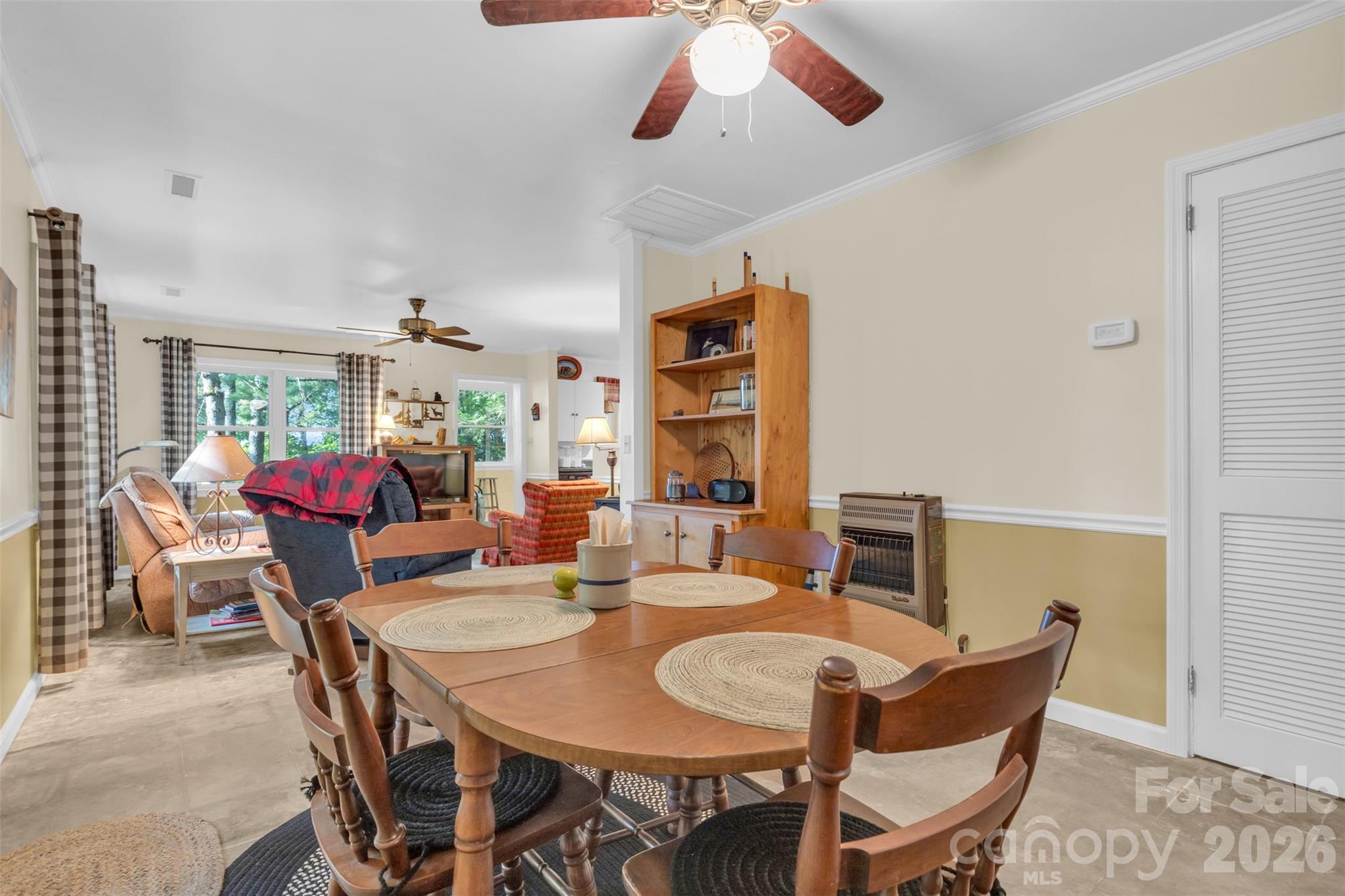 3605 Skyuka Mountain Road Columbus, NC 28722 - Photo 8 of 48 a view of a dining room with furniture and a potted plant