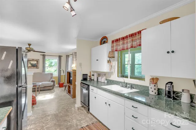 a spacious bathroom with a granite countertop sink mirror and shower