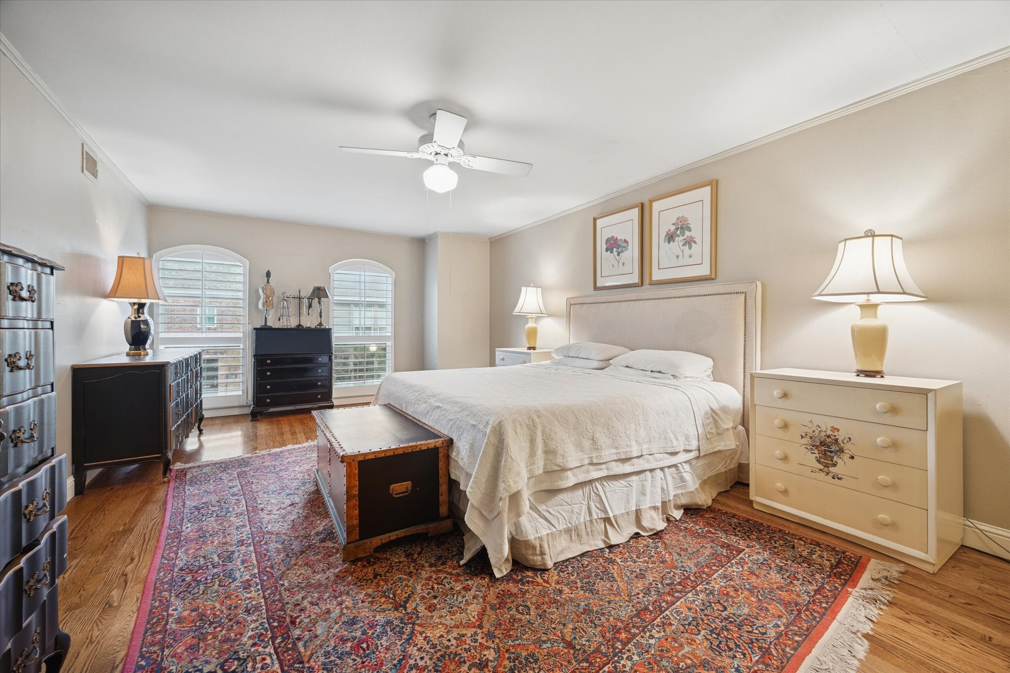 7525 Del Monte Drive Houston, TX 77063 - Photo 19 of 30 a spacious bedroom with a bed and a dresser in it